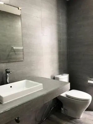a bathroom with a white sink and a toilet at TEAK VILLA in Bangna