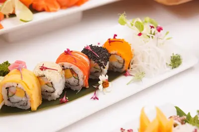 a plate of sushi on a white plate at Holiday Inn Bangkok by IHG in Bangkok