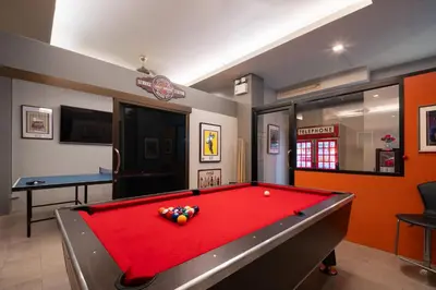 a billiard room with a pool table in it at iCheck inn Gems Center Silom in Bangkok