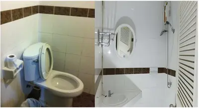 a bathroom with a toilet and a shower with a mirror at Orchid Place in Bangkok