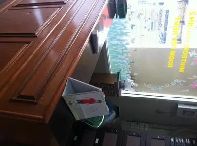 a drawer in a desk with a box on it at White Orchid Inn II in Bangkok