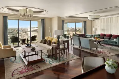 a living room with couches and chairs at Shangri-La Bangkok in Bangkok