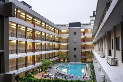 an image of an apartment building with a swimming pool at College Haus Rangnam in Bangkok