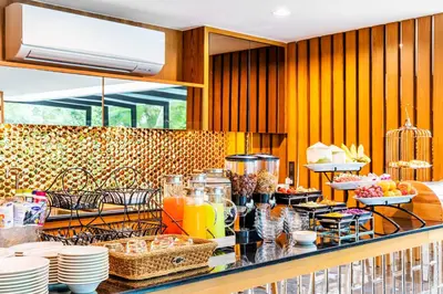 a buffet with food and drinks on a counter at The Grand Sala Thai in Bangkok