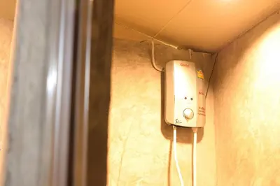 a room with a soap dispenser on a wall at Baankhon Private room in Thai house Check in by yourself code inbox Adult Only in Bangkok