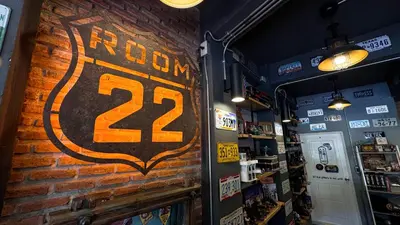 a brick wall with a sign on it in a store at Room 22 Hostel - near Chinatown in Bangkok