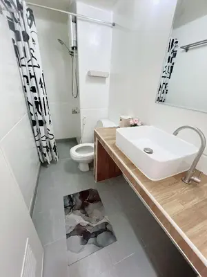a bathroom with a sink and a toilet at Condo Popular T4 Impact Muangthong by Tide in Pak Kret