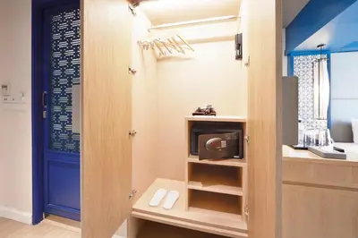 a small kitchen with a microwave in a room at The Quarter Hualamphong by UHG in Bangkok