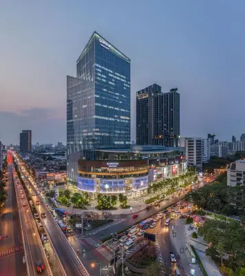 a city with tall buildings and a street with traffic at Triple Y Hotel in Bangkok