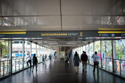 a group of people walking through a building at The Berkeley Hotel Pratunam in Bangkok