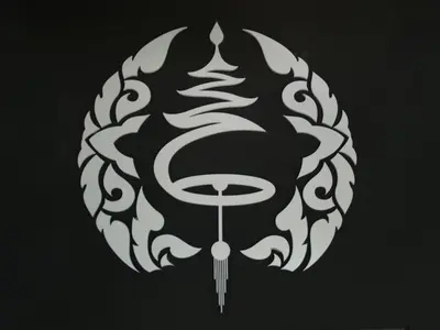 a black and white mask with a tail and a dagger at The Lantern Suites in Ban Song Hong