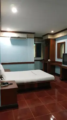 a large bed in a room with at West Wing Mansion in Bangkok