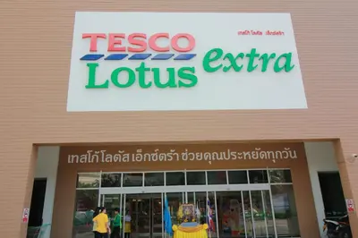 a tesco store with a sign on the front of it at Jasmine Grande Residence in Bangkok