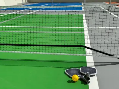 a skateboard on a tennis court with a net at Jasmine Grande Residence in Bangkok