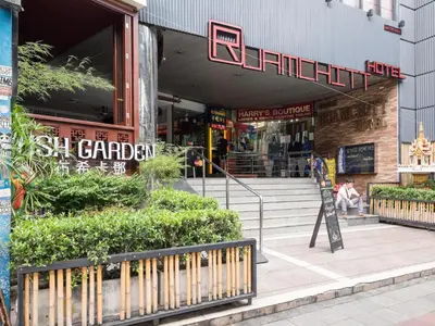 a store with a sign in front of a building at Ruamchitt Plaza Hotel in Bangkok