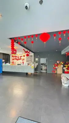 a room with red paper umbrellas hanging from the ceiling at The Gallery condominium in Samut Prakan