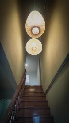 a stairway with two lights and a staircase with stairsogynbestosbestosbestosbestos at Bai Bua House Chatuchak in Ban Zong Katiam