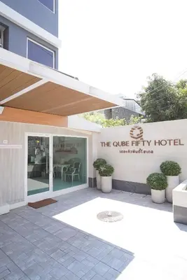 a building with a sign for the cube fifty hotel at The Qube fifty Hotel in Bangkok