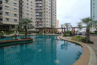 a swimming pool in front of some tall buildings at The Narathiwas Hotel & Residence Sathorn Bangkok in Bangkok