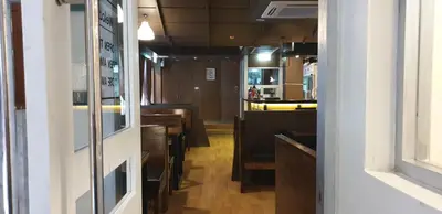 a hallway with a kitchen and a dining room at Vinary Hotel Sukhumvit in Bangkok