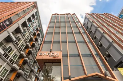 a building with a sign that reads baron at Baron Residence Bangkok in Bangkok