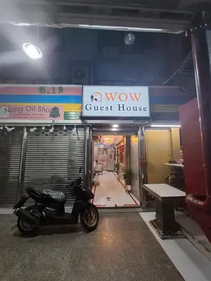 a motorcycle parked in front of a guest house at Wow Guesthouse in Bangkok