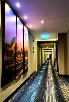 a hallway of a building with a view of a street at Amarin Hotel Rama 8 in Bangkok