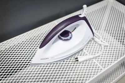 a iron sitting on top of a white grate at T1 Large Studio Full kitchen 100m. to BTS in Bangkok