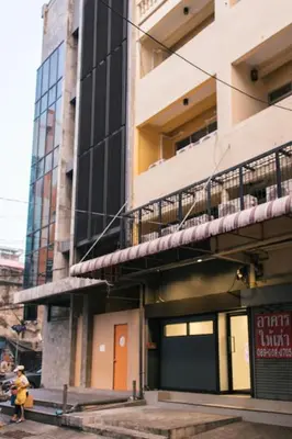 a building with a fire hydrant in front of it at T2 2 Bedrooms 6 guests Full kitchen 1 min to BTS in Bangkok