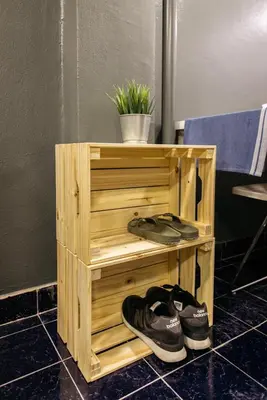 a wooden shelf with a pair of shoes and a plant at T2 2 Bedrooms 6 guests Full kitchen 1 min to BTS in Bangkok