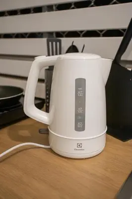 a white toaster sitting on top of a table at B2 Large + Comfort full kitchen near MRT Bangson in Bangkok