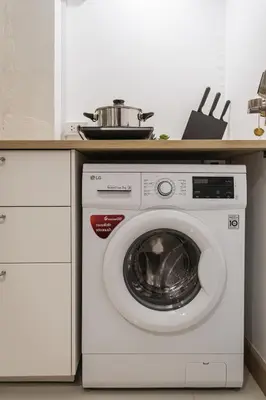 a washing machine with a pot on top of it at B2 Large + Comfort full kitchen near MRT Bangson in Bangkok