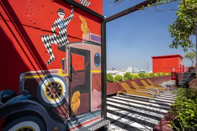 a mural of a train on the side of a building at MeStyle Museum Hotel in Bangkok