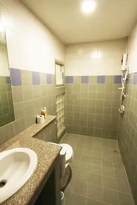 a bathroom with a sink and a toilet at 398 HOSTEL in Bangkok