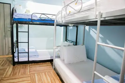 a bunk bed room with two bunk beds on a boat at Bangkok Canale Home at Khaosarn in Bangkok