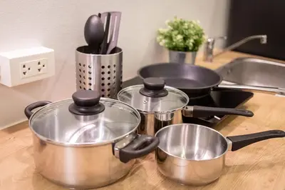 a group of pots and pans on a kitchen counter at U1 Large 2 bed rooms BTS Udomsuk in Bangkok