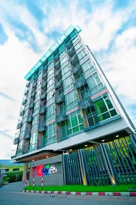a tall building with windows on the side of it at D Day Suite in Bangkok