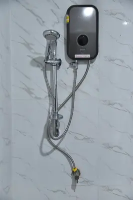 a cell phone is attached to a wall at Rose Nana Hotel in Bangkok
