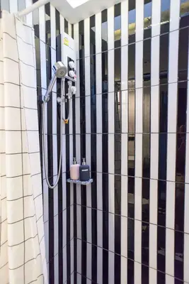 a shower on the side of a building at 87 Oldtown at River Pier in Bangkok
