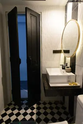 a bathroom with a sink and a mirror at 87 Oldtown at River Pier in Bangkok
