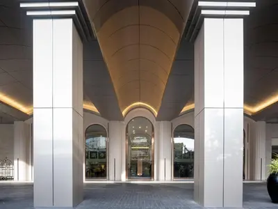 a large building with columns and a ceiling at Rembrandt Residences Bangkok in Bangkok