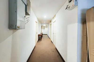 a corridor of an empty room with a hallway at Cordia Residence Sathorn in Bang Rak