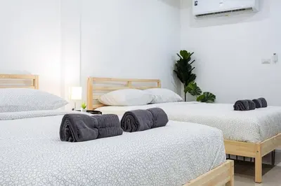 a bedroom with two beds with towels on them at P2 Silom Large 2beds full kitchen WIFI 4-6pax in Bangkok
