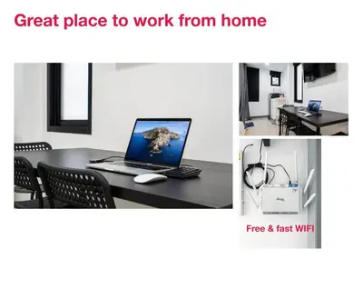 a table with a laptop computer on top of it at P2 Silom Large 2beds full kitchen WIFI 4-6pax in Bangkok