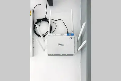 a computer sitting on a shelf in a door at P3 Silom Large 2beds full kitchen WIFI 4-6pax in Bangkok