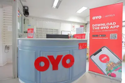 an omo counter in a pharmacy with a sign at Super OYO 498 Ladawan Villa in Bangkok