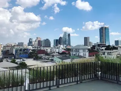 a view of the city from the roof of a building at The LOCAL Ari in Bangkok