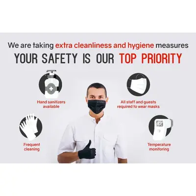 a man wearing a face mask with the words our safety is our top priority at FOODOTEL in Bangkok