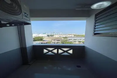 a room with a window with a view of a city at Sakun Place in Bangna