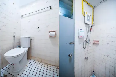 a bathroom with a toilet and a shower at Ali Hostel in Bangkok